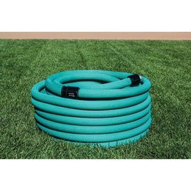 A coiled, green garden hose laid out on a grassy surface.
