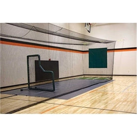 A black batting cage with a green background, featuring a large net and a small wooden structure with a red object on top.